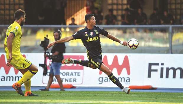 Juventusu2019 Cristiano Ronaldo (right) in action during the Italian Serie A match against AC Chievo in Verona, Italy, on Sunday. (AFP)
