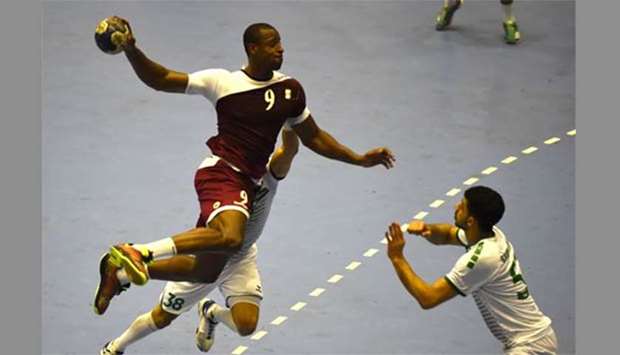 Qatar's Rafael Capote (left) tries to score a goal during the men's handball main round Group 1 match between Qatar and Saudi Arabia at the 2018 Asian Games in Jakarta on Wednesday.