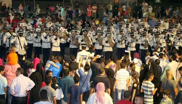 The police band's performances are among the activities drawing large crowds to the Cultural Village.