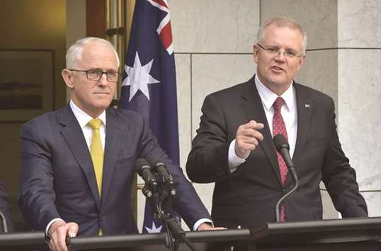 Australiau2019s Prime Minister Malcolm Turnbull (left) stands beside Treasurer Scott Morrison at a press conference in Parliament House in Canberra yesterday.