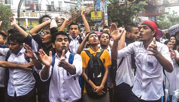 Bangladeshi students block a road during a student protest in Dhaka yesterday.
