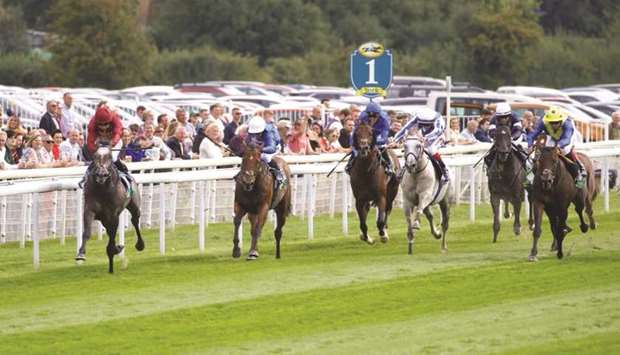 Oisin Murphy (left) rides Qatar Racingu2019s Roaring Lion to victory in the Juddmonte International Stakes (Gr1) in York, England, yesterday. (Racingfotos)