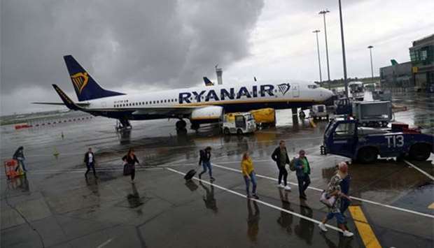 Passengers disembark a Ryanair flight at Dublin International Airport on Thursday.