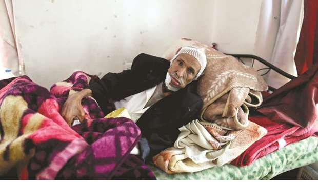 Ali Hizam Mused, 70, who has mouth cancer, lies on a bed at a charity which houses cancer patients in Sanaa.