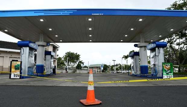 A gas station remains closed after running out of gas as Hurricane Lane approaches Honolulu, Hawaii