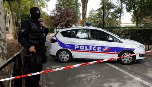 French police secure a street after a man killed two persons and injured another in a knife attack in Trappes, near Paris, according to French authorities, on Thursday.