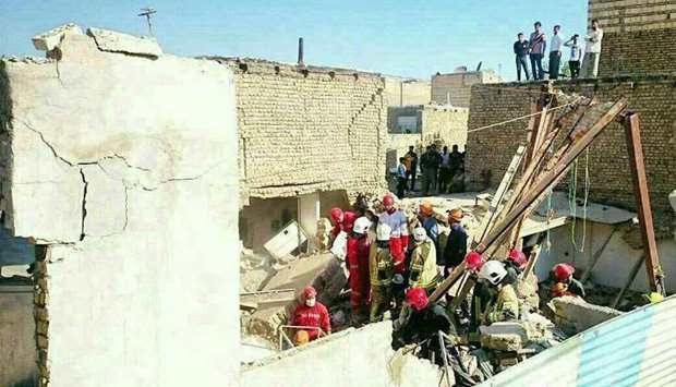 Rescue workers dig through the rubble of a building collapsed in the blast. Picture courtesy: Fars News