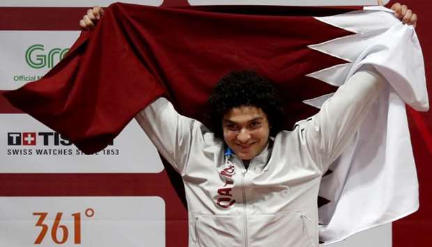 Silver medalist Fares Elbakh of Qatar celebrates on the podium