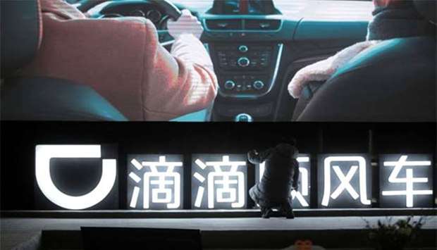 A Didi sign is seen before a promotional event of its Hitch service in Beijing.