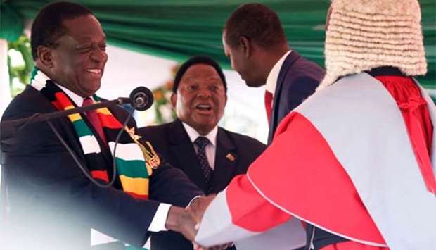Zimbabwe's President Emmerson Mnangagwa is congratulated by Chief Justice Luke Malaba after taking the oath of office during his presidential inauguration ceremony in Harare on Sunday.