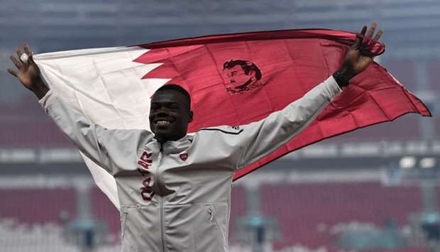 Gold medallist Qatar's Abdalelah Haroun celebrates during the victory ceremony