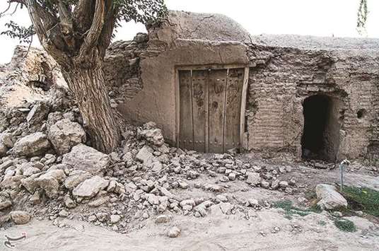 A damaged house is seen after an earthquake struck near the Iranian city of Kermanshah, yesterday.