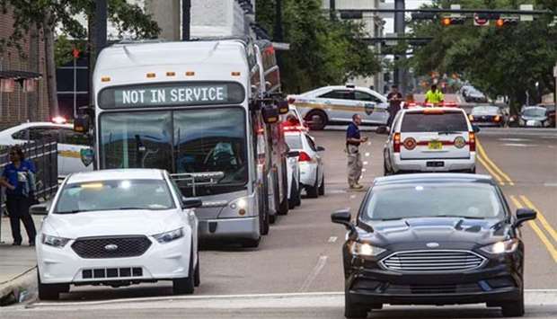 Law enforcement cars fill downtown after a shooting at Jacksonville Landing in Jacksonville, Florida on Sunday.