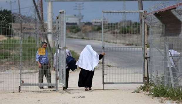 Palestinians are seen at the Erez crossing near Beit Hanun in Gaza Strip on Monday.
