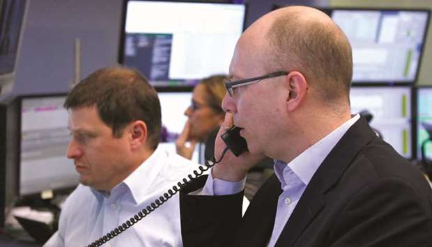 Traders at the Frankfurt Stock Exchange. The DAX 30 jumped 1.2% to 12,538.31 points yesterday.