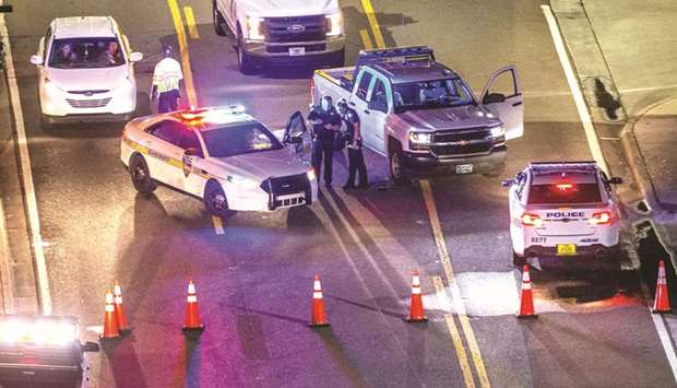 A heavy police presence remains into the night at the shooting outside Jacksonville Landing in Jacksonville, Florida.
