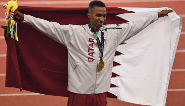 Qatar's Abubaker Abdalla celebrates during the victory ceremony for the men's 800m