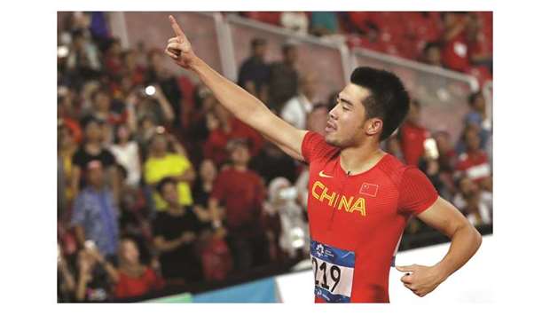 Xie Wenjun of China celebrates his victory in the menu2019s 110m hurdles final at the GBK Main Stadium in Jakarta yesterday. (Reuters)