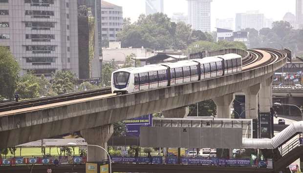 A Mass Rapid Transit (MRT) train travels along an elevated track in Kuala Lumpur (file). Malaysia has many examples of successfully funding infrastructure projects by sukuk. One of them is a cleverly designed investment product to finance the MRT project.