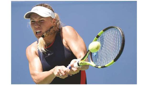 Caroline Wozniacki of Denmark returns against Samantha Stosur of Australia during their US Open first match at the USTA Billie Jean King National Tennis Centre in New York yesterday. Wozniacki won the match 6-3, 6-2. (AFP)