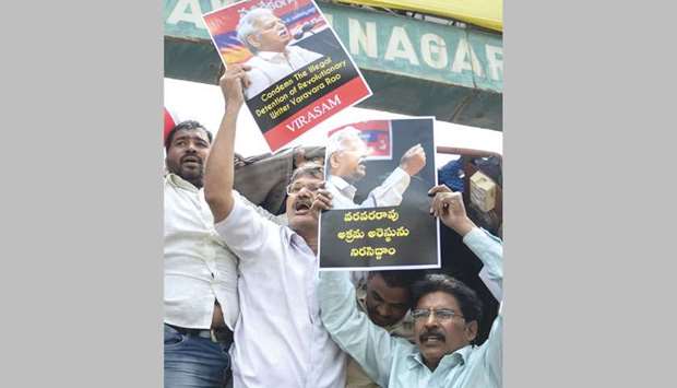 Activists of the Communist Party of India (Marxist-Leninist) New Democracy shout slogans during a protest against the arrest of poet and activist Varavara Rao in Hyderabad yesterday.