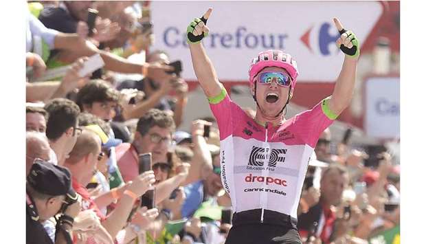 Education First-Drapacu2019s Australian cyclist Simon Clarke celebrates as he crosses the finish line, winning the fifth stage of the 73rd edition of u2018La Vueltau2019 race, a 188.7 km route from Granada to Roquetas de Mar, yesterday. (AFP)