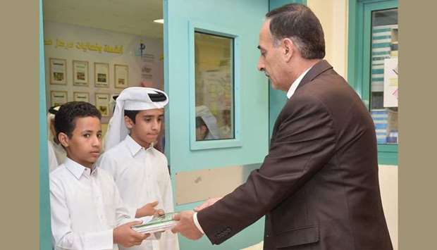 Students receiving their books at a school.