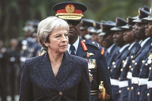 British Prime Minister Theresa May reviews a military guard of honour at the State House in Nairobi yesterday. Kenyan goods will retain preferential access to Britain after the UK leaves the European Union, May said during the visit to East Africau2019s biggest economy.