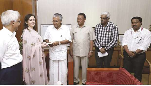 Reliance Foundation chairperson Nita M Ambani hands over a cheque of Rs210mn to Kerala Chief Minister Pinarayi Vijayan towards the Chief Ministeru2019s Relief Fund in Thiruvananthapuram yesterday.