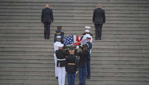 The casket of U.S. Senator John McCain is carried up the steps of the US Capitol in Washington D.C