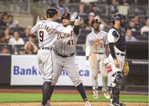 Detroit Tigers designated hitter Victor Martinez (centre) celebrates with teammate Nicholas Castellanos after hitting a two-run home run in the ninth innings against the New York Yankees at the Yankee Stadium on Thursday night. (USA TODAY Sports)