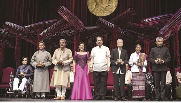 The 2018 Ramon Magsaysay Awardees, consisting of (from left) Vo Thi Hoang Yen of Vietnam, Sonam Wangchuk of India, Bharat Vatwani of India, Philippines Vice President Leni Robredo, Ramon Magsaysay Awards Foundation chairperson Senen Bacani, Howard Dee of Philippines, Maria de Lourdes Martins Cruz of East Timor and Youk Chhang of Cambodia, pose for a photo during the ceremony at the Cultural Center  in Manila, yesterday.