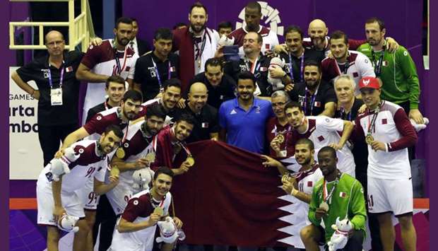 Qatar handball players show off their gold medals as they pose with Qatar Olympic Committee president HE Sheikh Joaan bin Hamad al-Thani and Qatar Handball Association president Ahmad al-Shaabi.Qatar defeated Bahrain 32-27 to retain the Asian Games gold in Jakarta.