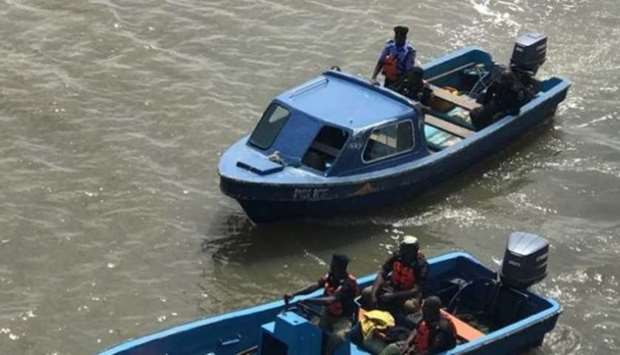 Marine Police conducts rescue operations after a boat capsized in Pashi River, Badagry, Lagos State on July 29