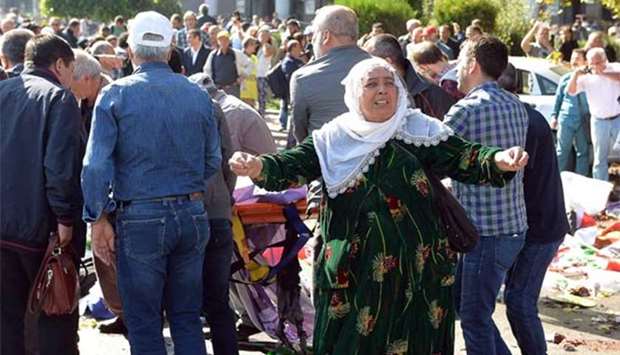 A woman reacts following an explosion at the main train station in Turkey's capital Ankara on October 10, 2015. File picture