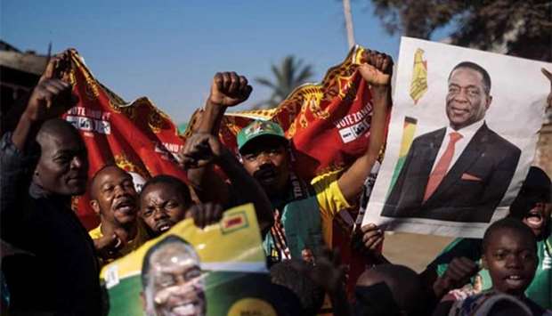 Supporters of the newly re-elected president Emmerson Mnangagwa celebrate in Mbare, Harare, on Friday.