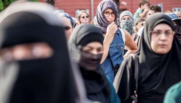 Demonstrators are pictured on the first day of the implementation of the Danish face veil ban in Copenhagen on Wednesday.