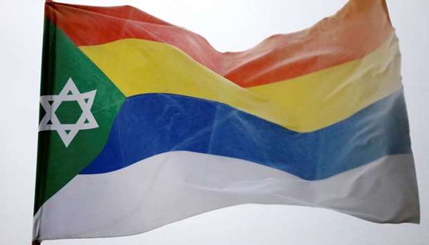 The Druze flag decorated with a Star of David can be seen in the Druze town of Daliat al-Karmel, northern Israel on Thursday.
