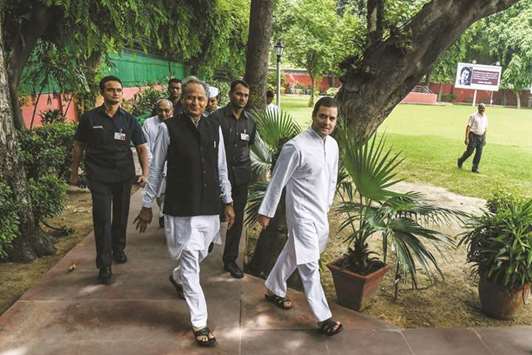 Congress president Rahul Gandhi and senior party leaders walk to All India Congress Committee offices in New Delhi for a meeting yesterday.