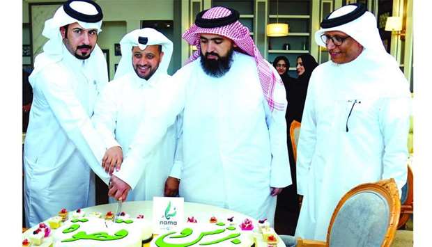 Al-Mohannadi and other dignitaries cut the ceremonial cake to launch the u2018Business and Coffeeu2019 project. PICTURE: Ram Chand