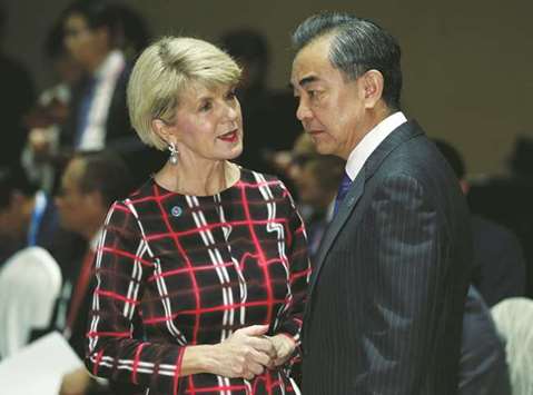 Julie Bishop speaks with Wang Yi in Singapore yesterday.