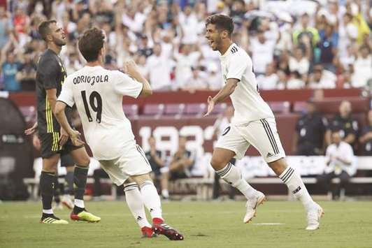Marco Asensio (right) of Real Madrid celebrates after scoring a goal against Juventus during the International Champions Cup in Maryland, US, on Saturday night. (AFP)