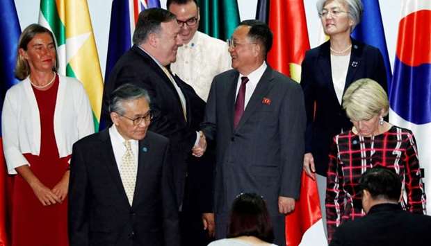 US Secretary of State Mike Pompeo shakes hands with North Korea's Foreign Minister Ri Yong Ho at the Asean Regional Forum Retreat in Singapore on August 4, 2018.