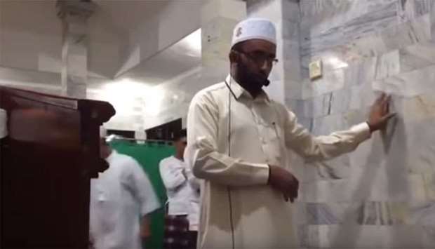 A screenshot of a video posted on social media shows the Imam supporting himself against the wall as the room shaking violently around him during the prayer.