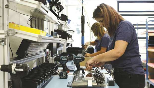 An employee fits mirrored panels to an ARRI SkyPanel light-emitting diode (LED) light at the ARRI AG cinematic and television lighting factory in Stephanskirchen, Germany. The Federal Statistics Office said yesterday that contracts for u201cMade in Germanyu201d goods fell by 4.0% on the month in June after rising 2.6% the previous month.