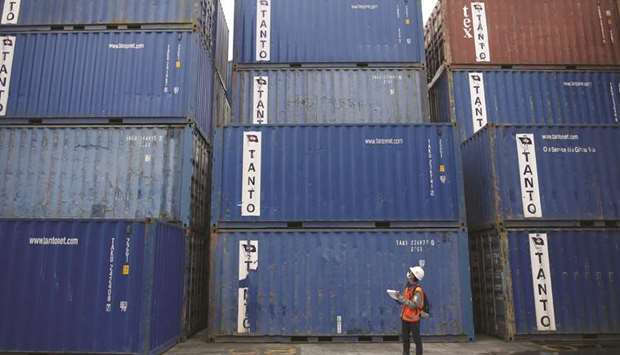 A worker tracks shipping containers in Tanjung Priok port in North Jakarta. Indonesiau2019s economy beat forecasts and grew the fastest in 4-1/2 years in April-June, helped by robust consumption during the holy month of Ramadan, but headwinds cloud the outlook for lifting growth well above 5%.