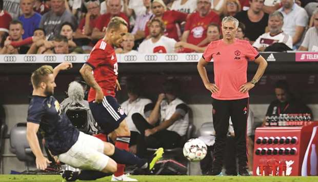 Manchester United manager Jose Mourinho (right) looks on during his teamu2019s match pre-season friendly against Bayern Munich on Sunday night. (Reuters)