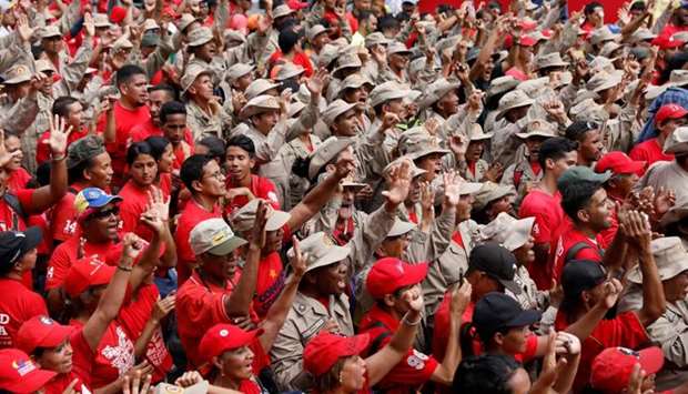 Militia members and supporters of Venezuela's President Nicolas Maduro attend a rally in support of him in Caracas