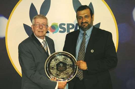 Abdul Majeed al-Reyahi (right) receiving the RoSPA Electricity Industry Sector Award at a ceremony in the UK.
