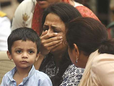 Kanika Rane holds her son Agastya as she mourns during the funeral of her husband Major Kaustubh Rane, who was killed in a gun battle in Kashmir, in Mira Road yesterday.